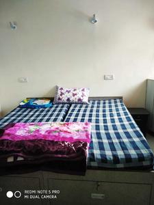 Bedroom Image of Arpit PG in Begumpur