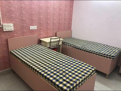 Bedroom Image of Eshu PG in Greater Kailash